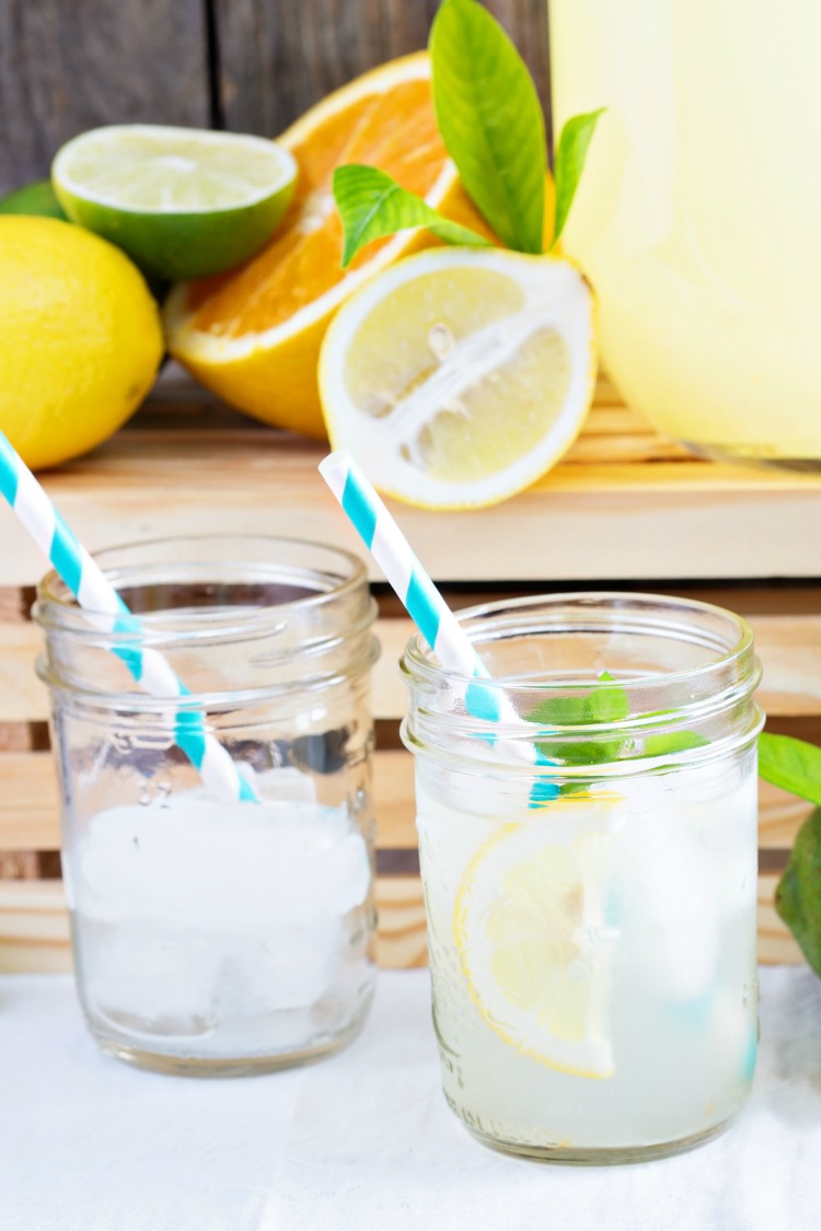 Homemade lemonade in beverage dispencer and mason jars