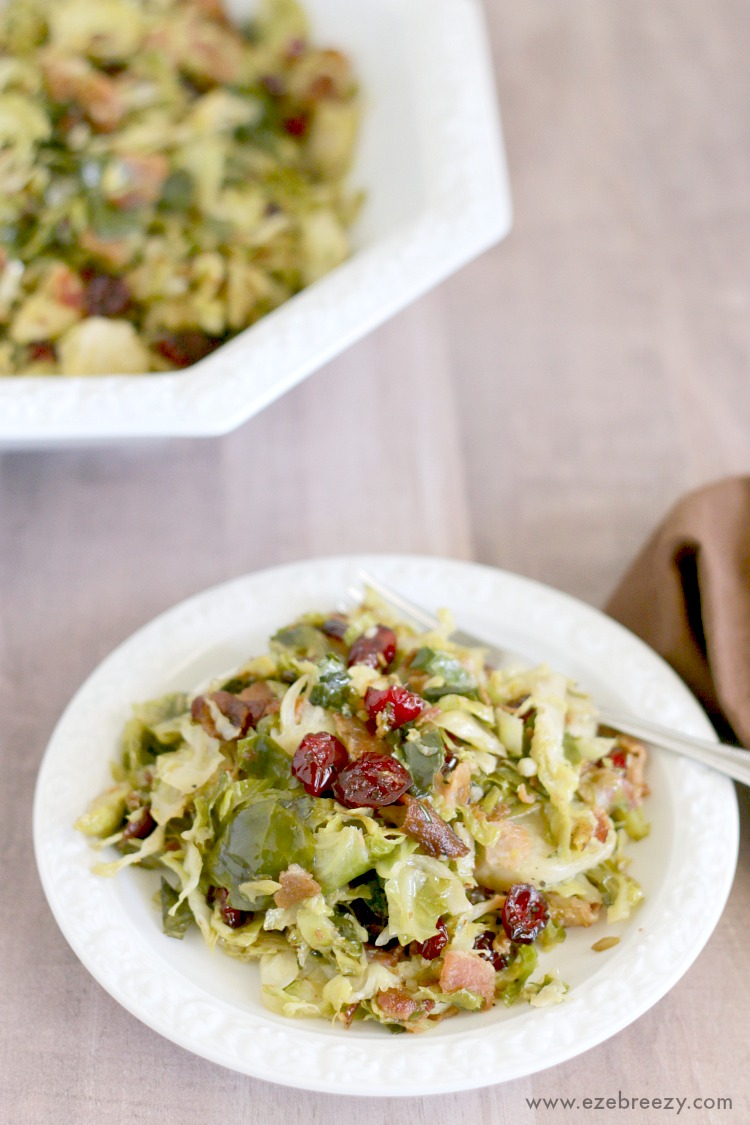  Delicious Brussels Sprouts pan-fried to perfection and tossed with sweet dried cranberries and crispy bacon; the perfect side dish for your next holiday gathering | ezebreezy.com | #Thanksgiving #Thanksgivingrecipes #sidedishes #recipes #easyrecipes #Christmasrecipes #Christmas
